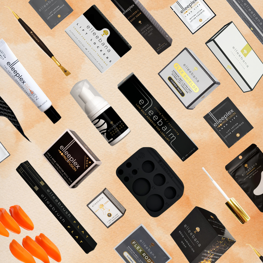 Flat lay of Elleebana lash and brow supplies, including boxed kits, applicators, tools, and product containers.